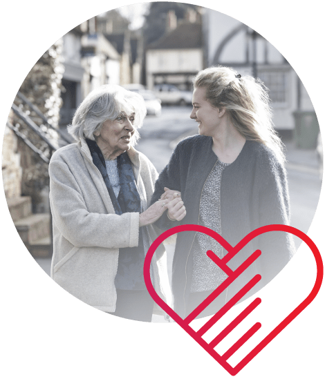 Elderly woman walking with younger woman